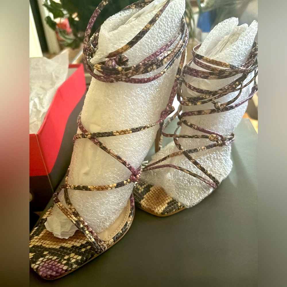 Vince Camuto lace up heels. Snake print
